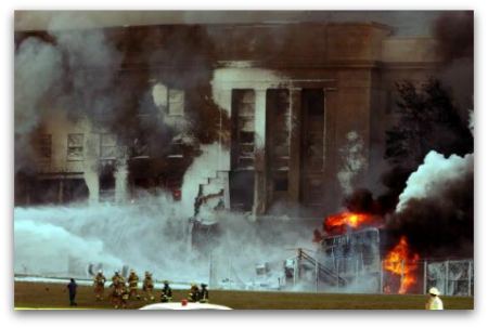 The Pentagon in flames after terrorists flew hijacked American Airlines Flight 77 into the side of the building on September 11, 2001.