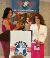 Military Motherhood Award 2010 recipient Robin Schoolfield is presented the award by actress Wendy Davis of <i>Army Wives.</i>